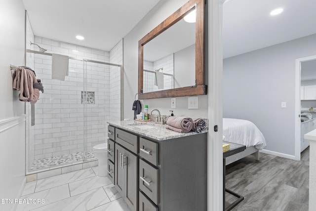 2940 Tower Rd, Sevierville, TN 37876 - ensuite bathroom featuring vanity, a stall shower, toilet, recessed lighting, and baseboards