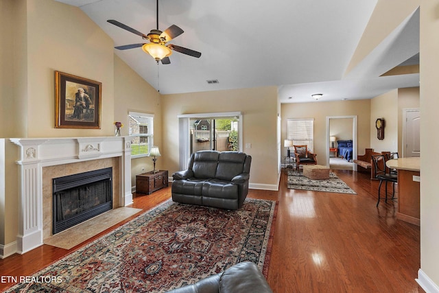4921 Willow Bluff Cir, Knoxville, TN 37914 - living room featuring a ceiling fan, wood finished floors, a fireplace, baseboards, and high vaulted ceiling