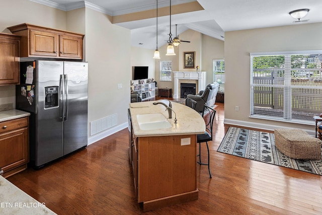 4921 Willow Bluff Cir, Knoxville, TN 37914 - kitchen with stainless steel fridge, a sink, dark wood finished floors, open floor plan, and vaulted ceiling