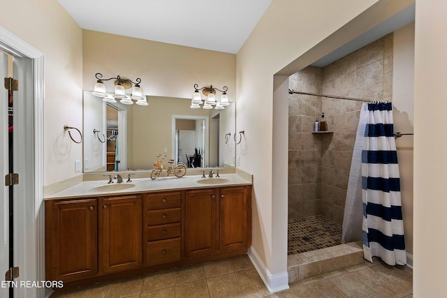 4921 Willow Bluff Cir, Knoxville, TN 37914 - bathroom featuring a tile shower, a chandelier, double vanity, and tile patterned floors
