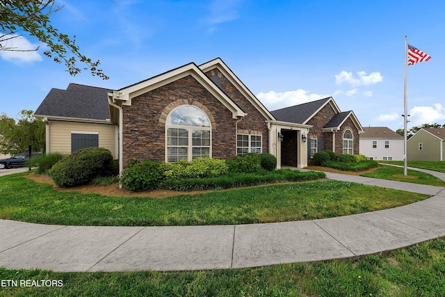 4921 Willow Bluff Cir, Knoxville, TN 37914 - ranch-style home with a front yard and stone siding