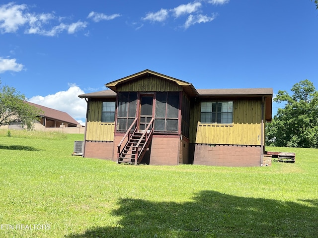 243 Choctaw Ln, Niota, TN 37826 - rear view of property featuring a lawn and central air condition unit