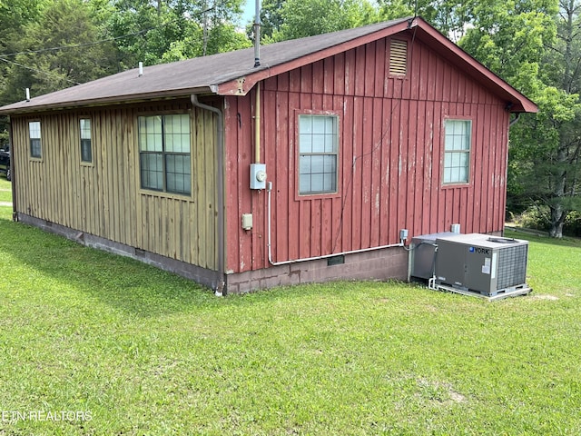 243 Choctaw Ln, Niota, TN 37826 - view of side of property with cooling unit, a yard, crawl space, and board and batten siding