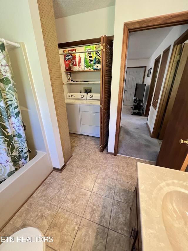 243 Choctaw Ln, Niota, TN 37826 - bathroom with washer and clothes dryer, vanity, baseboards, shower / bath combination with curtain, and toilet