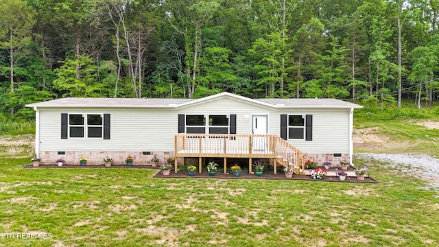 1587 Sweetwater Rd, Philadelphia, TN 37846 - view of front of property with crawl space, a front lawn, and a view of trees