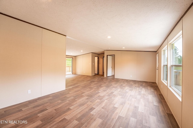 1587 Sweetwater Rd, Philadelphia, TN 37846 - empty room with wood finished floors, a textured ceiling, and recessed lighting