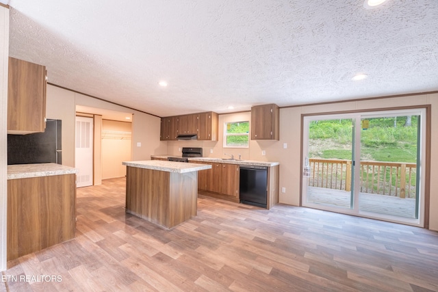 1587 Sweetwater Rd, Philadelphia, TN 37846 - kitchen featuring dishwasher, light wood-style flooring, light countertops, range with electric cooktop, and freestanding refrigerator