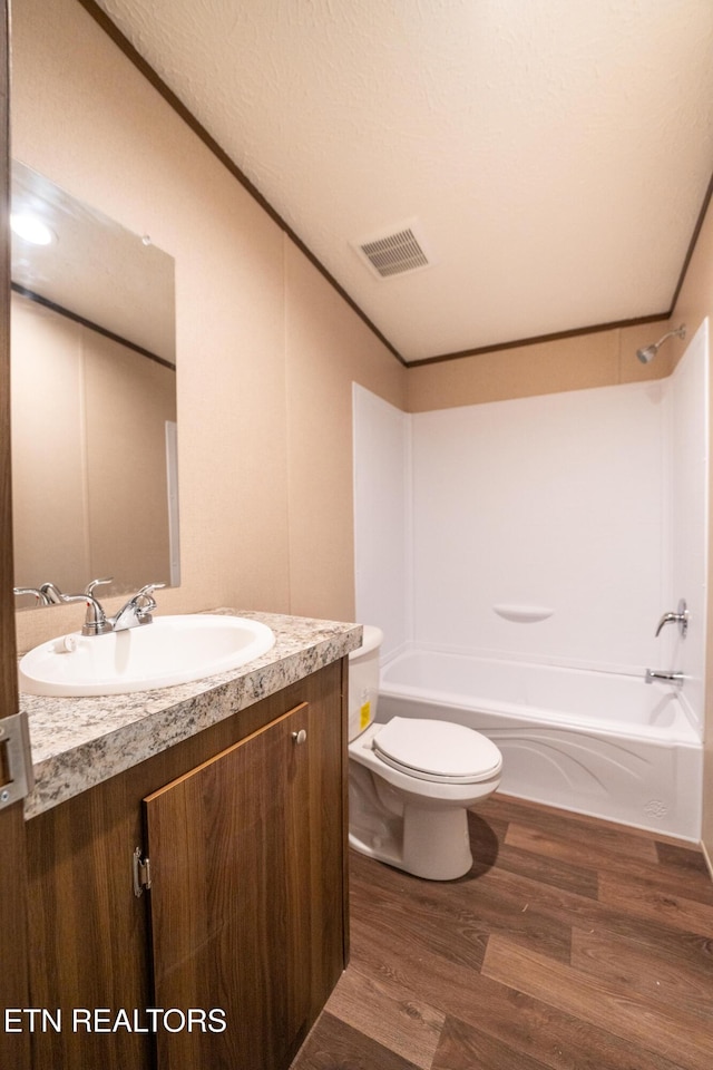 1587 Sweetwater Rd, Philadelphia, TN 37846 - full bath with toilet, wood finished floors, vanity, and shower / bathtub combination