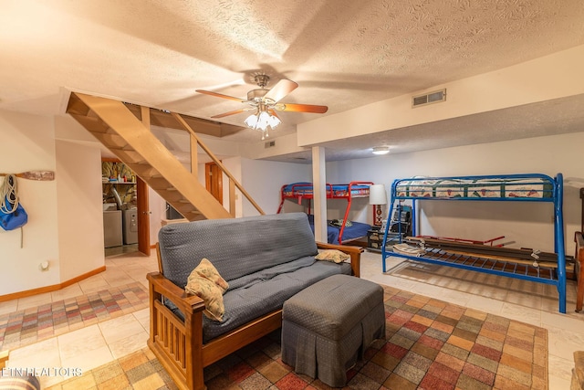 258 Marina Ln, Lafollette, TN 37766 - tiled living area with stairway, a textured ceiling, baseboards, and ceiling fan