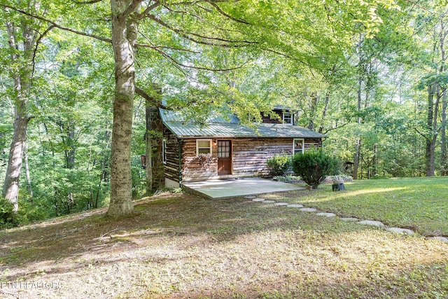258 Marina Ln, Lafollette, TN 37766 - view of front of property with a patio, a view of trees, log siding, metal roof, and a front yard