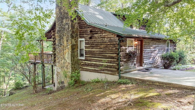 258 Marina Ln, Lafollette, TN 37766 - view of side of home with metal roof and log exterior