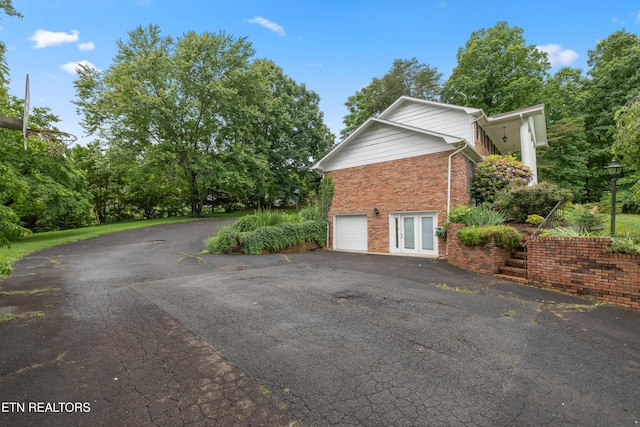 10628 Sandpiper Ln, Knoxville, TN 37922 - view of home's exterior with asphalt driveway and brick siding