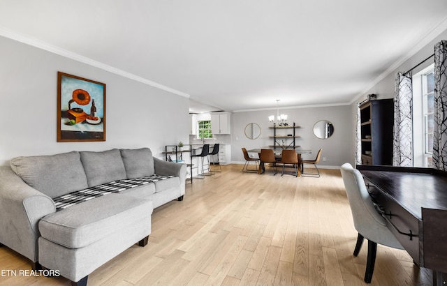 10628 Sandpiper Ln, Knoxville, TN 37922 - living area with light wood-type flooring, crown molding, a chandelier, and baseboards
