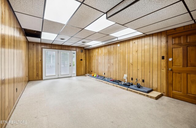 10628 Sandpiper Ln, Knoxville, TN 37922 - unfurnished room featuring wood walls, carpet flooring, a paneled ceiling, and french doors