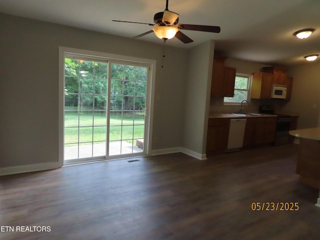 5820 Rockwood Ln, Knoxville, TN 37921 - kitchen featuring white appliances, baseboards, dark wood finished floors, and a sink