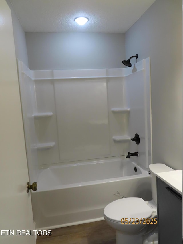 5820 Rockwood Ln, Knoxville, TN 37921 - full bathroom featuring toilet, vanity, bathing tub / shower combination, wood finished floors, and a textured ceiling