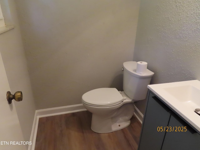 5820 Rockwood Ln, Knoxville, TN 37921 - half bath featuring wood finished floors, vanity, toilet, and baseboards