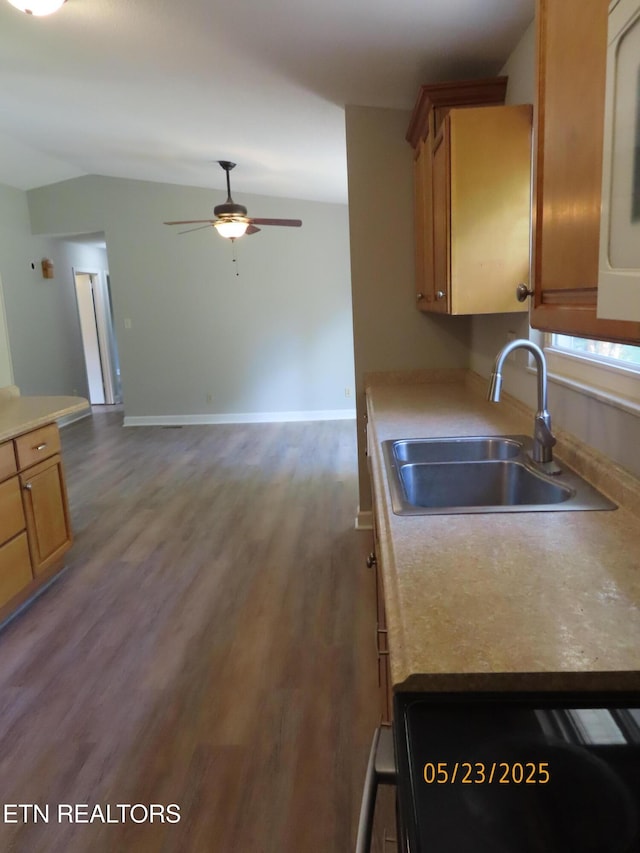 5820 Rockwood Ln, Knoxville, TN 37921 - kitchen featuring a sink, ceiling fan, lofted ceiling, light countertops, and wood finished floors