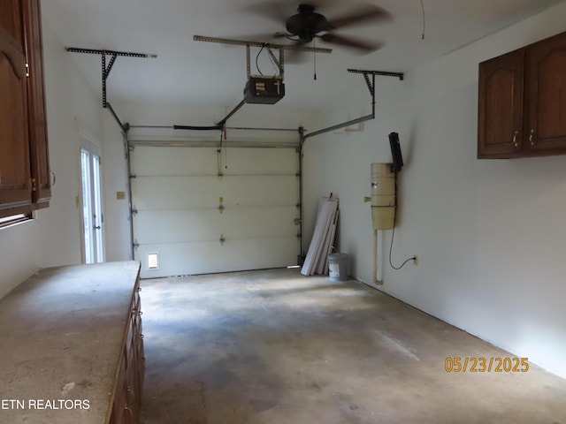 5820 Rockwood Ln, Knoxville, TN 37921 - garage with a central vacuum unit, a ceiling fan, and a garage door opener