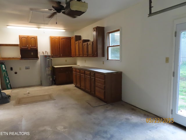 5820 Rockwood Ln, Knoxville, TN 37921 - garage featuring electric water heater, a garage door opener, and a ceiling fan