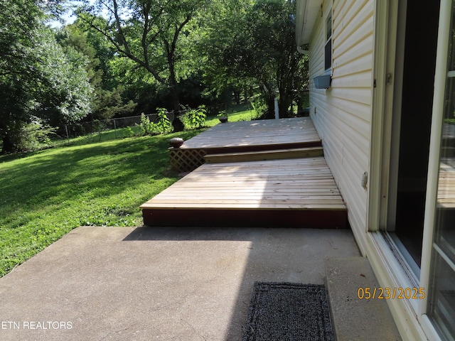 5820 Rockwood Ln, Knoxville, TN 37921 - wooden deck with a patio and view of wooded area