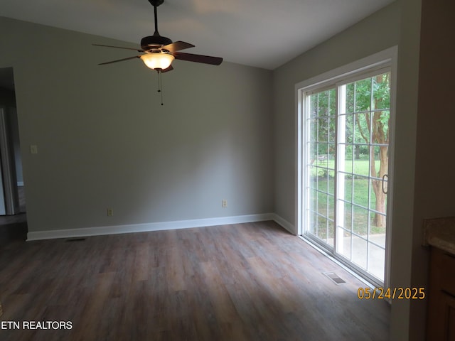 5820 Rockwood Ln, Knoxville, TN 37921 - unfurnished room with wood finished floors, a ceiling fan, and baseboards