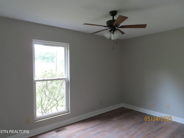 5820 Rockwood Ln, Knoxville, TN 37921 - spare room with baseboards, a ceiling fan, and wood finished floors
