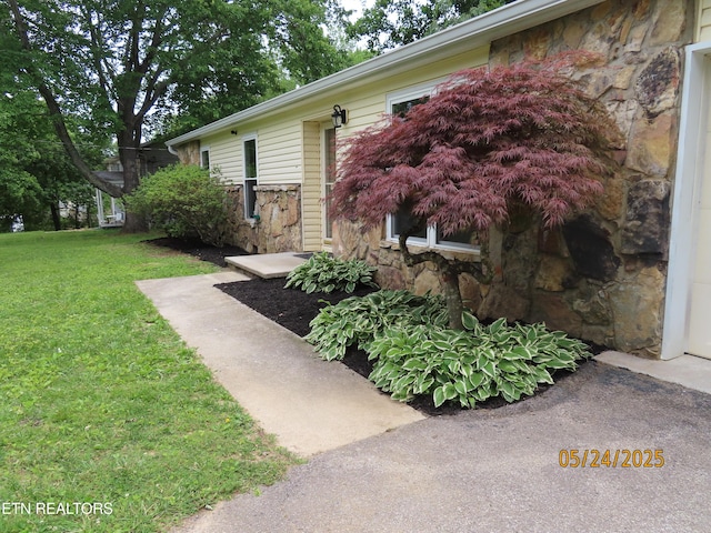 5820 Rockwood Ln, Knoxville, TN 37921 - doorway to property with stone siding and a lawn
