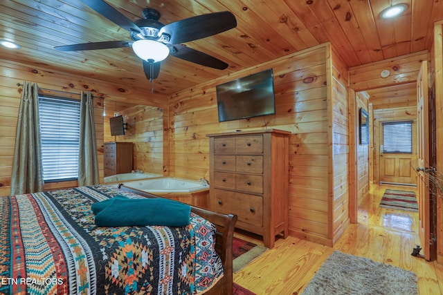 1127 Oak Ct, Gatlinburg, TN 37738 - bedroom with wooden ceiling, light wood-style flooring, wood walls, multiple windows, and recessed lighting