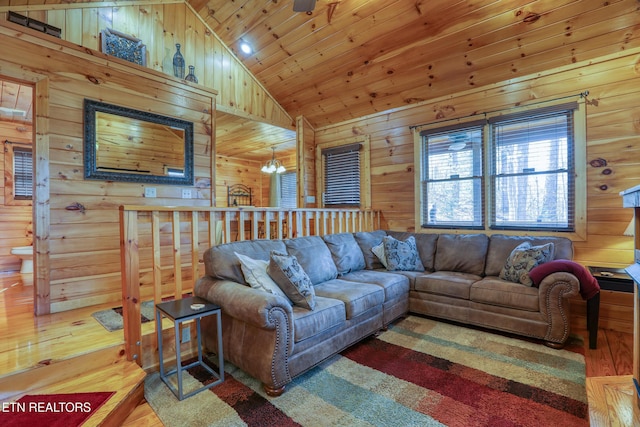 1127 Oak Ct, Gatlinburg, TN 37738 - living room featuring lofted ceiling, wood-type flooring, wood walls, a chandelier, and wood ceiling