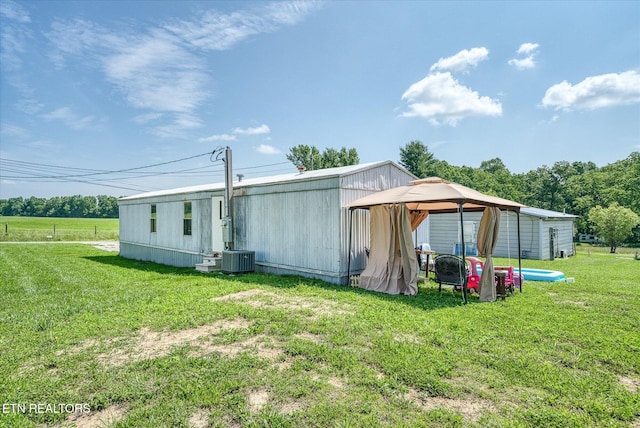 170 Bob Austin Rd, Crossville, TN 38571 - rear view of house featuring a lawn, a gazebo, and central AC unit