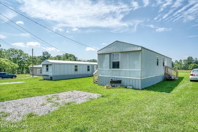 170 Bob Austin Rd, Crossville, TN 38571 - rear view of house featuring a yard