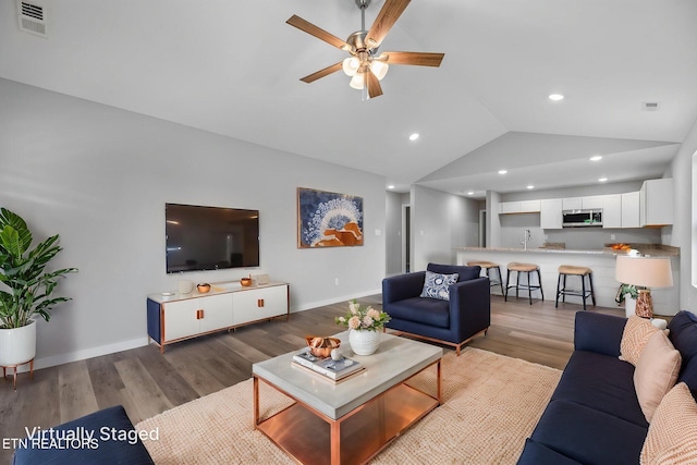 319 S Elmwood St, Knoxville, TN 37914 - living area featuring vaulted ceiling, ceiling fan, wood finished floors, baseboards, and recessed lighting