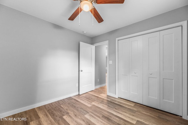 319 S Elmwood St, Knoxville, TN 37914 - unfurnished bedroom featuring wood finished floors, baseboards, a closet, and ceiling fan