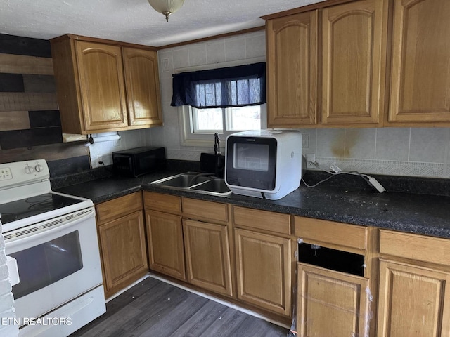 142 W Wadsworth Cir, Oak Ridge, TN 37830 - kitchen with electric range, a sink, dark wood-style flooring, black microwave, and dark countertops
