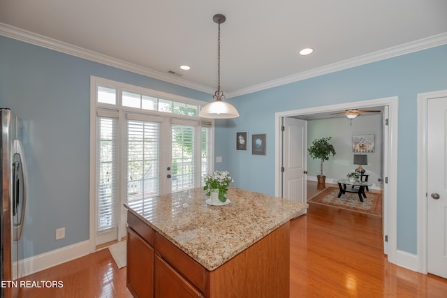 1101 Main St Unit 19, Loudon, TN 37774 - kitchen with stainless steel fridge with ice dispenser, ornamental molding, light wood-style floors, a center island, and pendant lighting