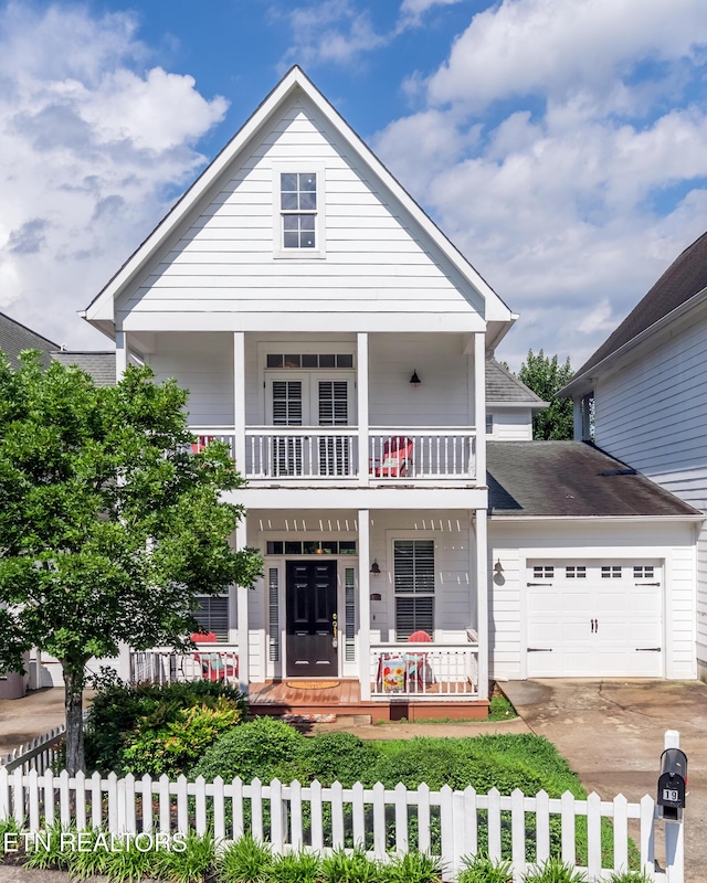 1101 Main St Unit 19, Loudon, TN 37774 - view of front of home with a porch, a balcony, a fenced front yard, and an attached garage