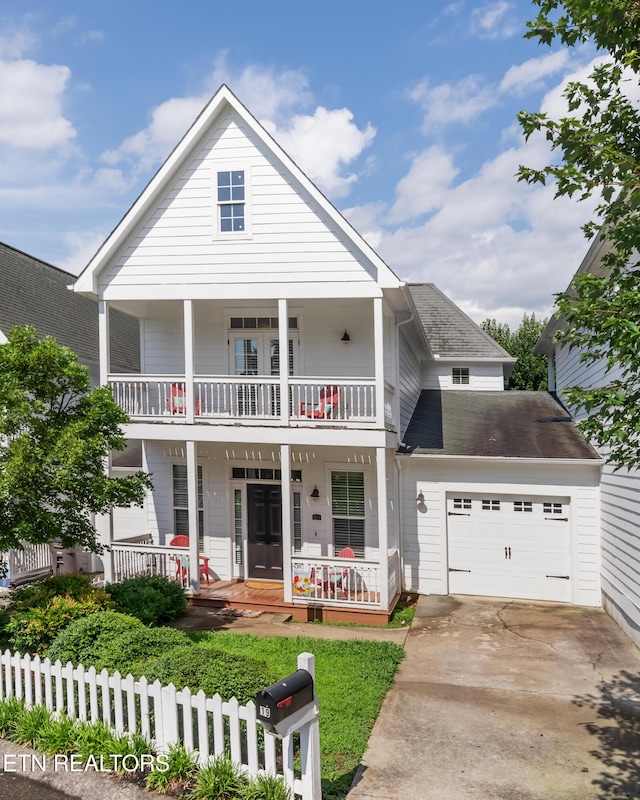 1101 Main St Unit 19, Loudon, TN 37774 - view of front of home featuring covered porch, a balcony, concrete driveway, and an attached garage