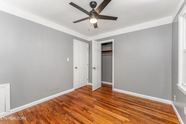 3712 Selma Ave, Knoxville, TN 37914 - unfurnished bedroom with wood finished floors, baseboards, a closet, and ceiling fan