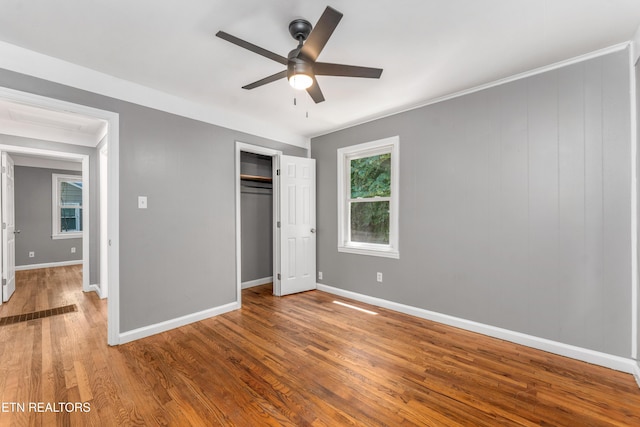 3712 Selma Ave, Knoxville, TN 37914 - unfurnished bedroom with wood finished floors, baseboards, a closet, and ceiling fan