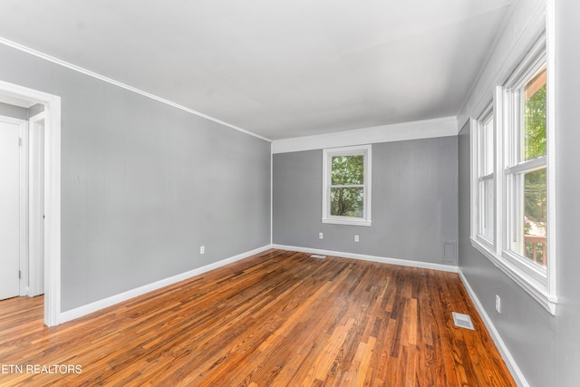 3712 Selma Ave, Knoxville, TN 37914 - unfurnished room with wood-type flooring, crown molding, and baseboards