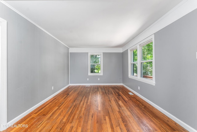 3712 Selma Ave, Knoxville, TN 37914 - empty room featuring wood-type flooring, crown molding, and baseboards