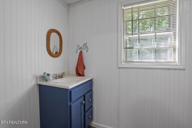 147 Cove Hollow Rd, Lafollette, TN 37766 - bathroom featuring vanity and wood walls