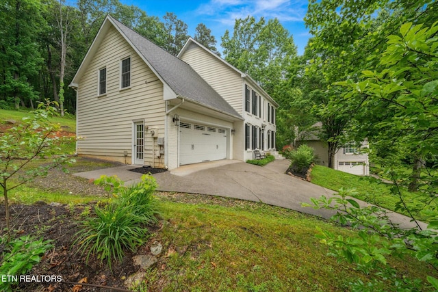 2819 Dee Peppers Dr, Knoxville, TN 37931 - view of property exterior featuring concrete driveway, roof with shingles, and a garage