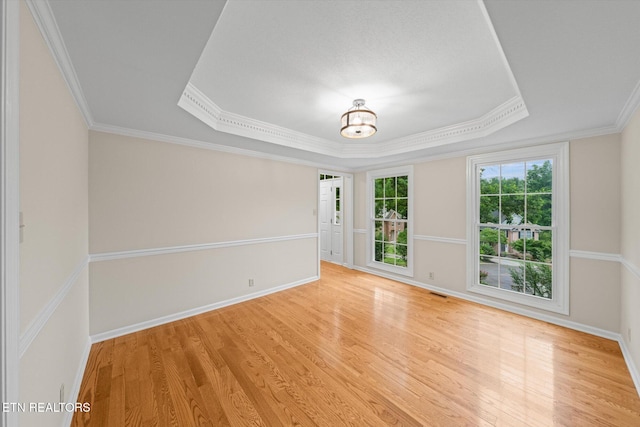 2819 Dee Peppers Dr, Knoxville, TN 37931 - empty room with a raised ceiling, wood finished floors, ornamental molding, baseboards, and a chandelier