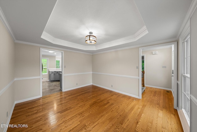 2819 Dee Peppers Dr, Knoxville, TN 37931 - unfurnished room with a raised ceiling, light wood-type flooring, ornamental molding, and baseboards