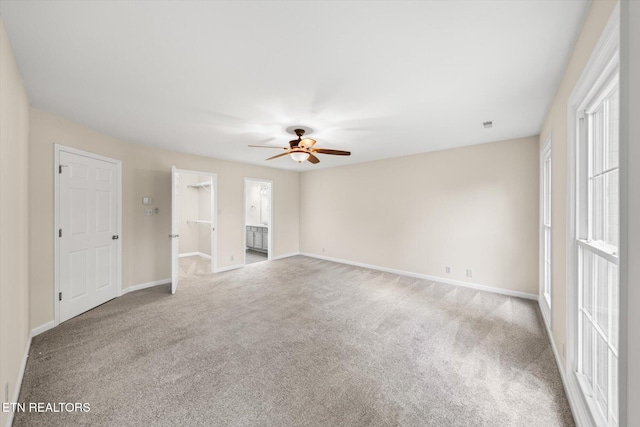 2819 Dee Peppers Dr, Knoxville, TN 37931 - unfurnished living room featuring a ceiling fan, carpet flooring, baseboards, and healthy amount of natural light