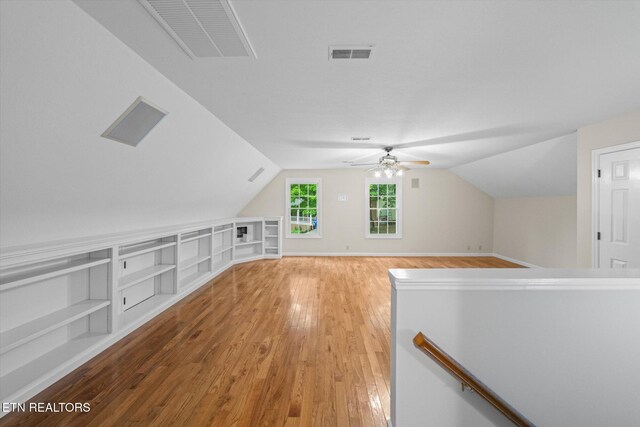 2819 Dee Peppers Dr, Knoxville, TN 37931 - additional living space featuring light wood finished floors, vaulted ceiling, a ceiling fan, built in features, and baseboards