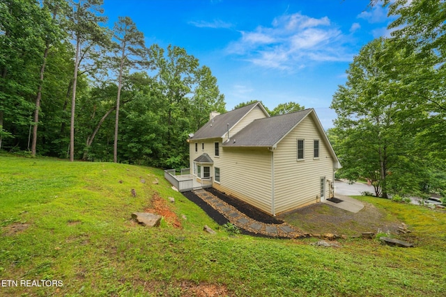 2819 Dee Peppers Dr, Knoxville, TN 37931 - view of side of home with a deck, a lawn, and a chimney