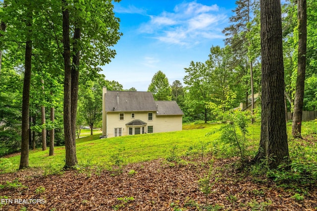 2819 Dee Peppers Dr, Knoxville, TN 37931 - back of property with a lawn and a chimney